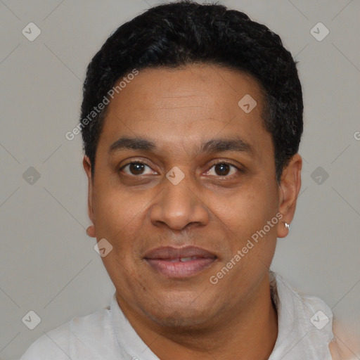 Joyful latino adult male with short  black hair and brown eyes