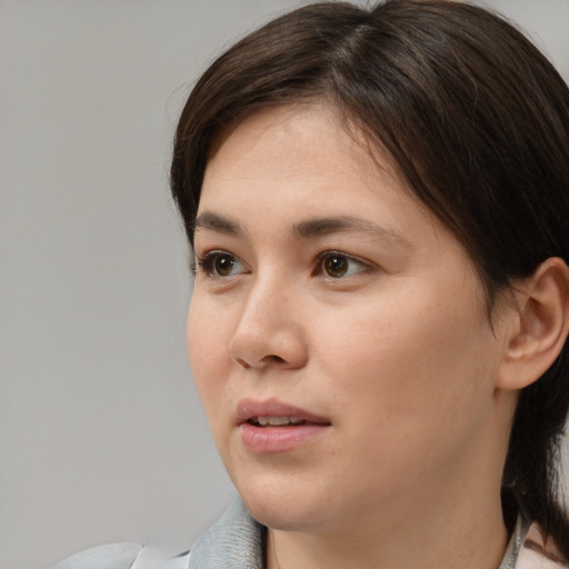 Neutral white young-adult female with medium  brown hair and brown eyes