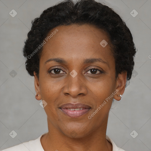 Joyful black adult female with short  brown hair and brown eyes