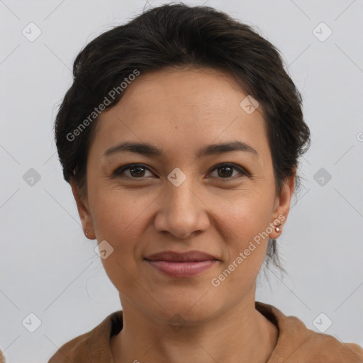 Joyful latino young-adult female with short  brown hair and brown eyes