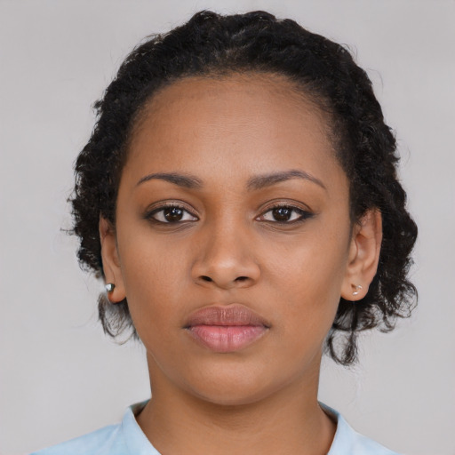 Neutral black young-adult female with medium  black hair and brown eyes