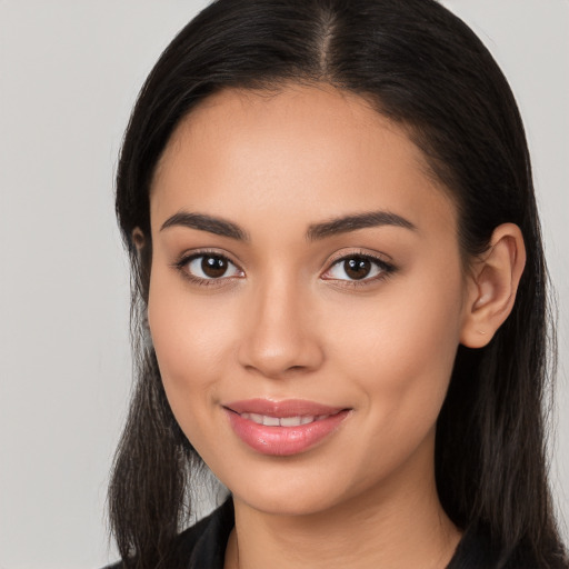 Joyful white young-adult female with long  black hair and brown eyes