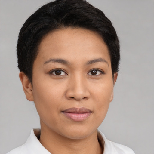 Joyful latino young-adult female with short  brown hair and brown eyes