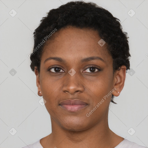 Joyful black young-adult female with short  black hair and brown eyes