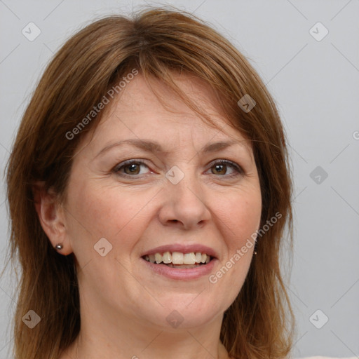 Joyful white adult female with medium  brown hair and green eyes