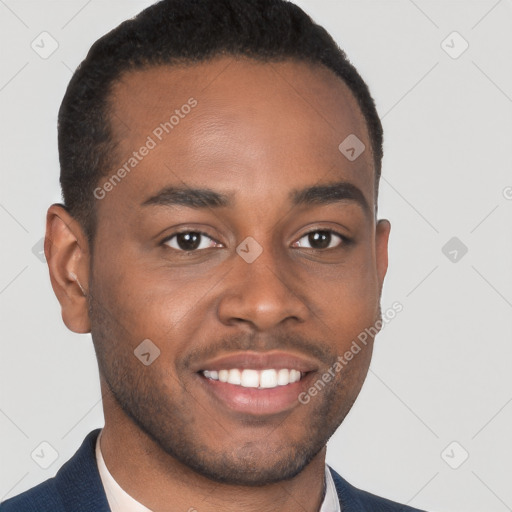 Joyful black young-adult male with short  brown hair and brown eyes