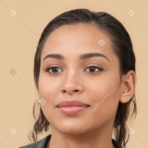 Joyful latino young-adult female with medium  brown hair and brown eyes