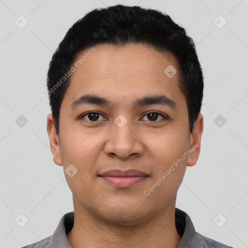 Joyful latino young-adult male with short  black hair and brown eyes