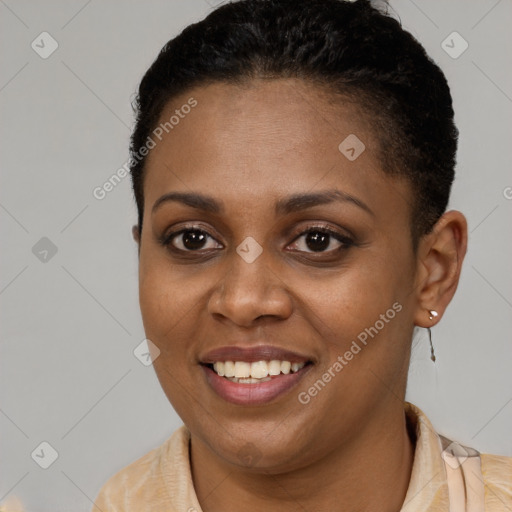 Joyful black young-adult female with short  brown hair and brown eyes