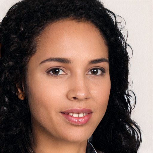 Joyful latino young-adult female with long  brown hair and brown eyes