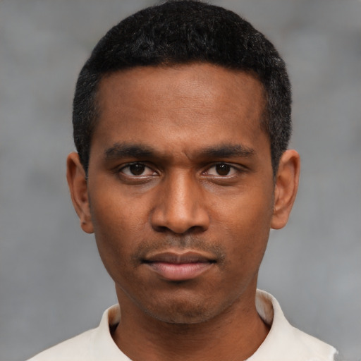 Neutral black young-adult male with short  black hair and brown eyes