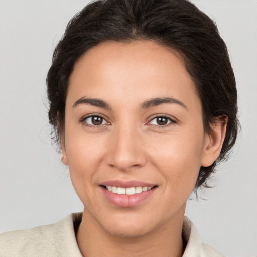 Joyful white young-adult female with medium  brown hair and brown eyes