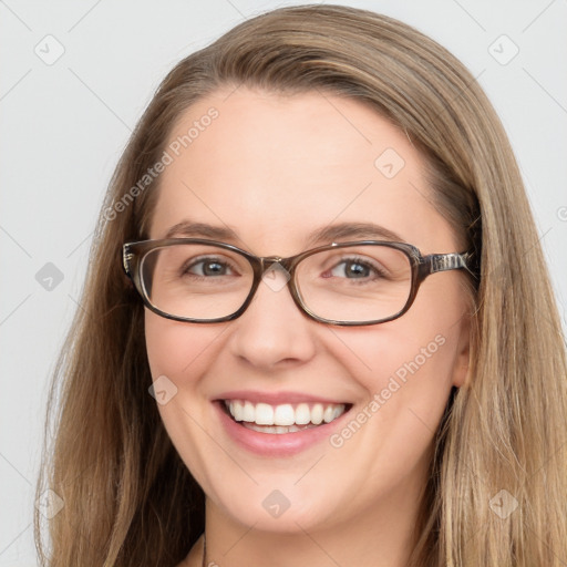 Joyful white young-adult female with long  brown hair and green eyes