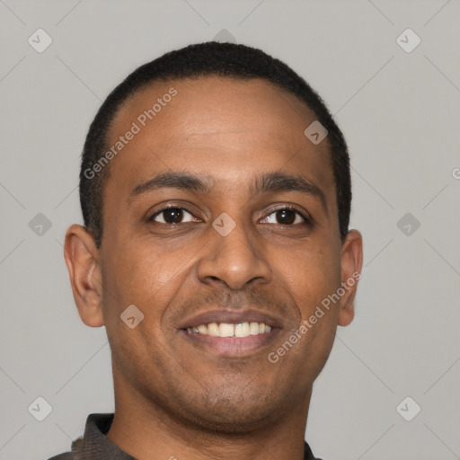 Joyful latino young-adult male with short  brown hair and brown eyes