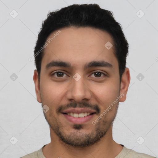 Joyful white young-adult male with short  black hair and brown eyes