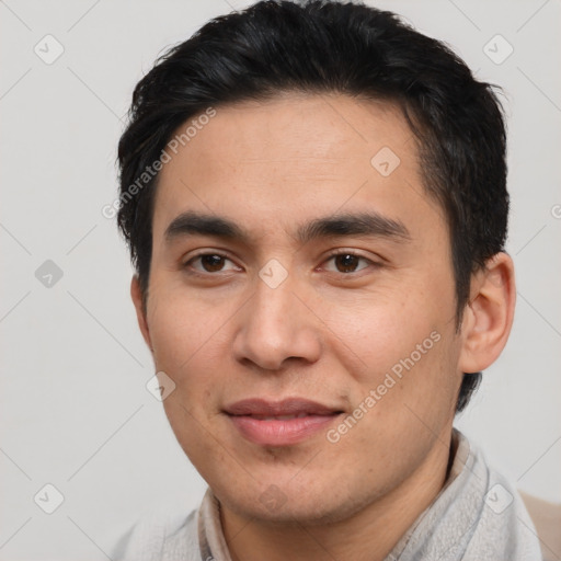 Joyful latino young-adult male with short  brown hair and brown eyes