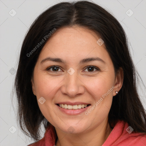 Joyful white adult female with medium  brown hair and brown eyes