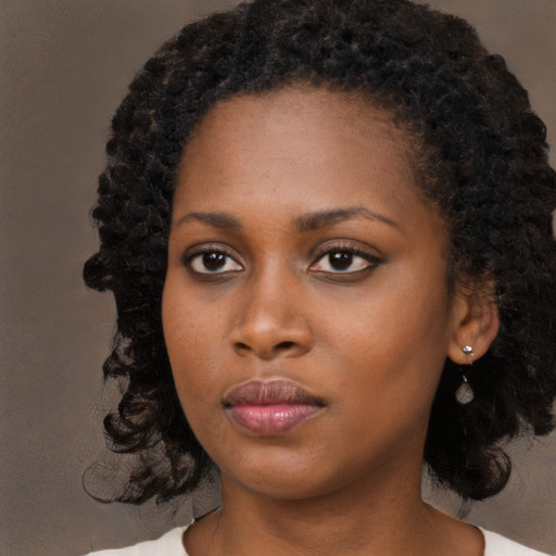Neutral black young-adult female with long  black hair and brown eyes