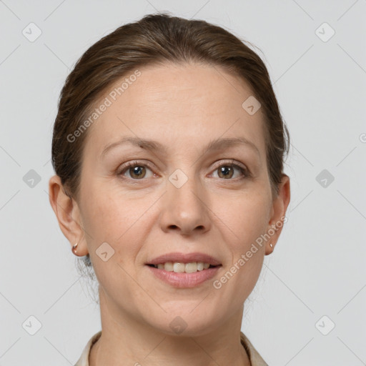 Joyful white adult female with short  brown hair and grey eyes