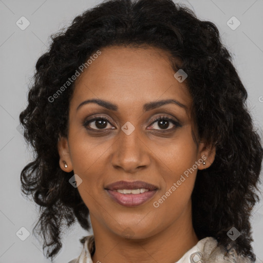 Joyful black young-adult female with long  brown hair and brown eyes