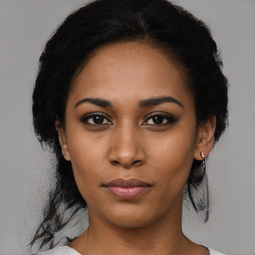 Neutral latino young-adult female with medium  black hair and brown eyes