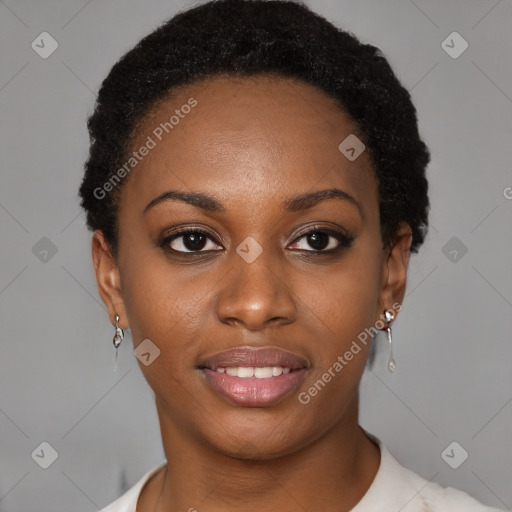 Joyful black young-adult female with short  brown hair and brown eyes