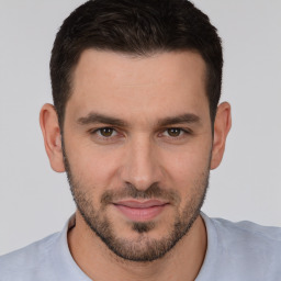 Joyful white young-adult male with short  brown hair and brown eyes