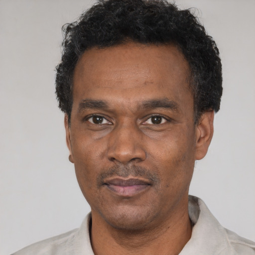Neutral latino adult male with short  black hair and brown eyes