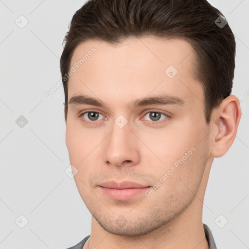 Neutral white young-adult male with short  brown hair and brown eyes