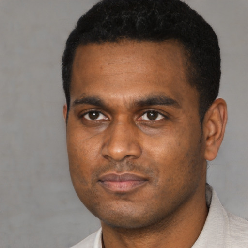 Neutral black young-adult male with short  black hair and brown eyes
