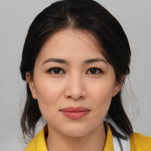 Joyful asian young-adult female with medium  brown hair and brown eyes