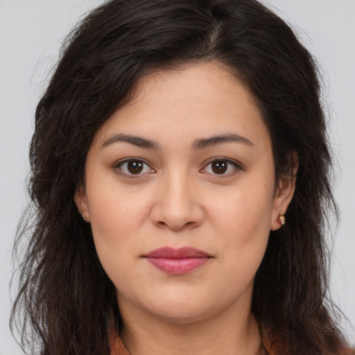 Joyful white young-adult female with long  brown hair and brown eyes