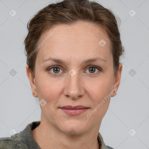 Joyful white adult female with short  brown hair and grey eyes