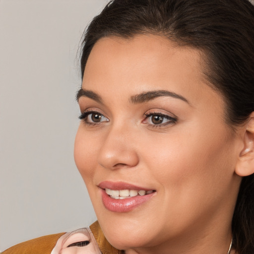 Joyful white young-adult female with medium  brown hair and brown eyes