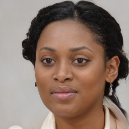 Joyful black young-adult female with medium  brown hair and brown eyes