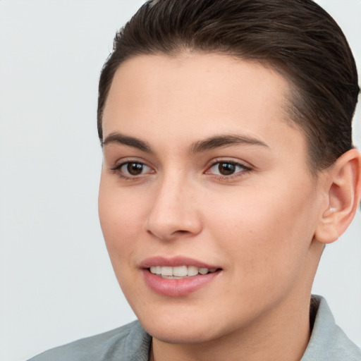 Joyful white young-adult female with short  brown hair and brown eyes