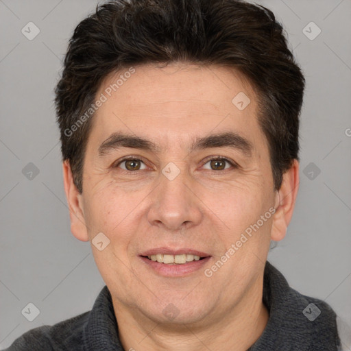 Joyful white adult male with short  brown hair and brown eyes