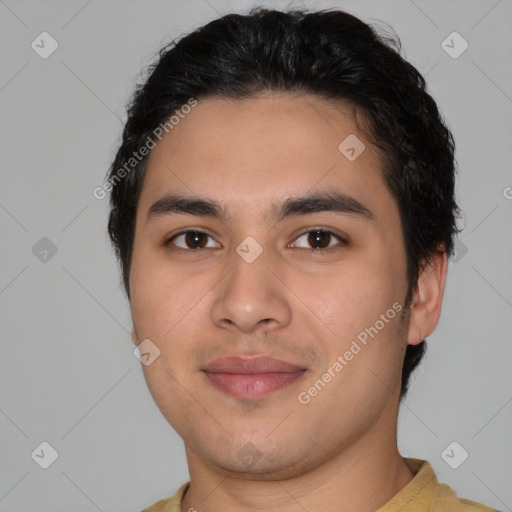 Joyful latino young-adult male with short  black hair and brown eyes