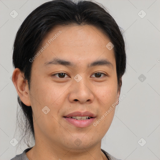 Joyful asian young-adult male with short  brown hair and brown eyes