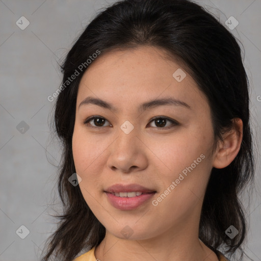 Joyful asian young-adult female with medium  brown hair and brown eyes