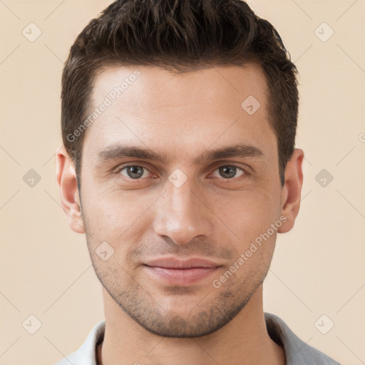 Joyful white young-adult male with short  brown hair and brown eyes