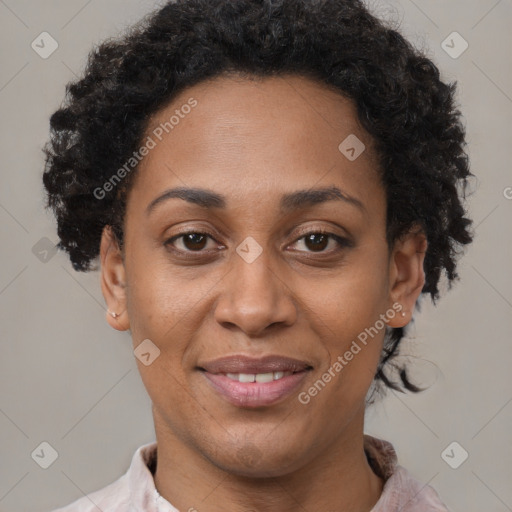 Joyful black adult female with short  brown hair and brown eyes