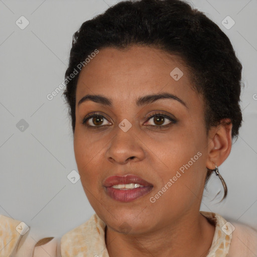 Joyful latino young-adult female with short  brown hair and brown eyes