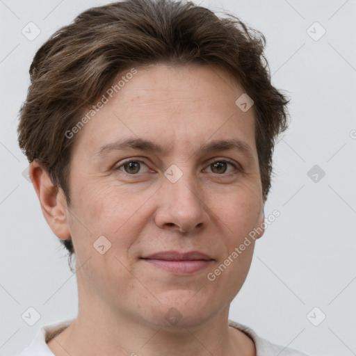 Joyful white adult female with short  brown hair and grey eyes