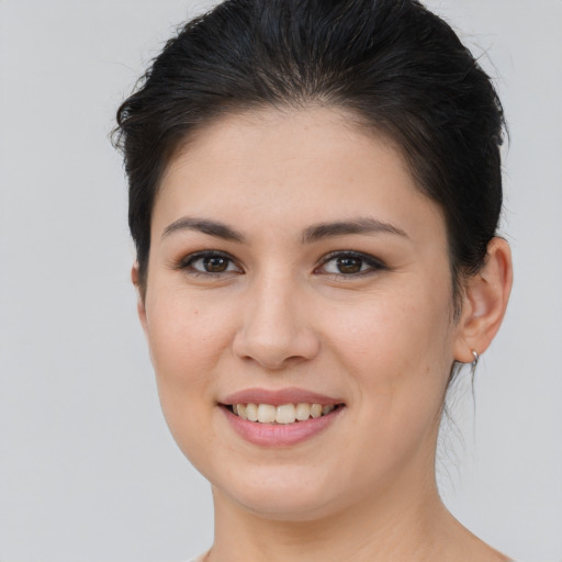 Joyful white young-adult female with medium  brown hair and brown eyes