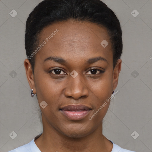 Joyful black young-adult female with short  black hair and brown eyes