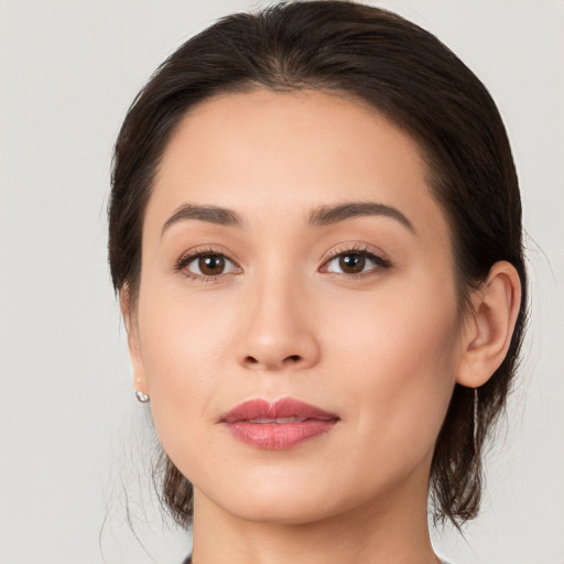 Joyful white young-adult female with medium  brown hair and brown eyes