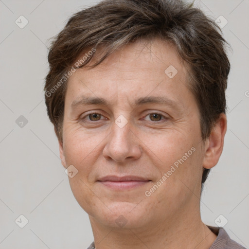 Joyful white adult female with short  brown hair and brown eyes