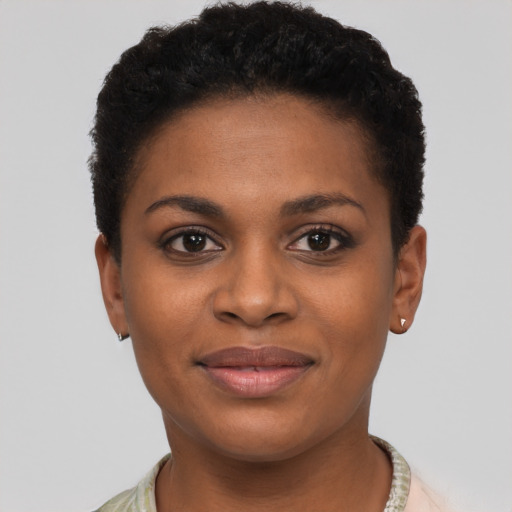 Joyful black young-adult female with short  brown hair and brown eyes