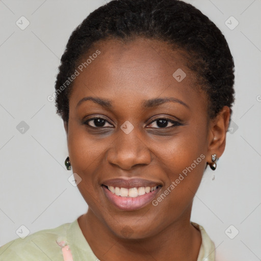 Joyful black young-adult female with short  black hair and brown eyes